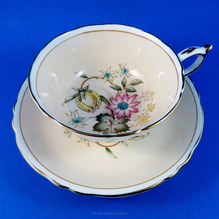 パラゴン　ピンク地に手描きの花模様のカップ&ソーサー