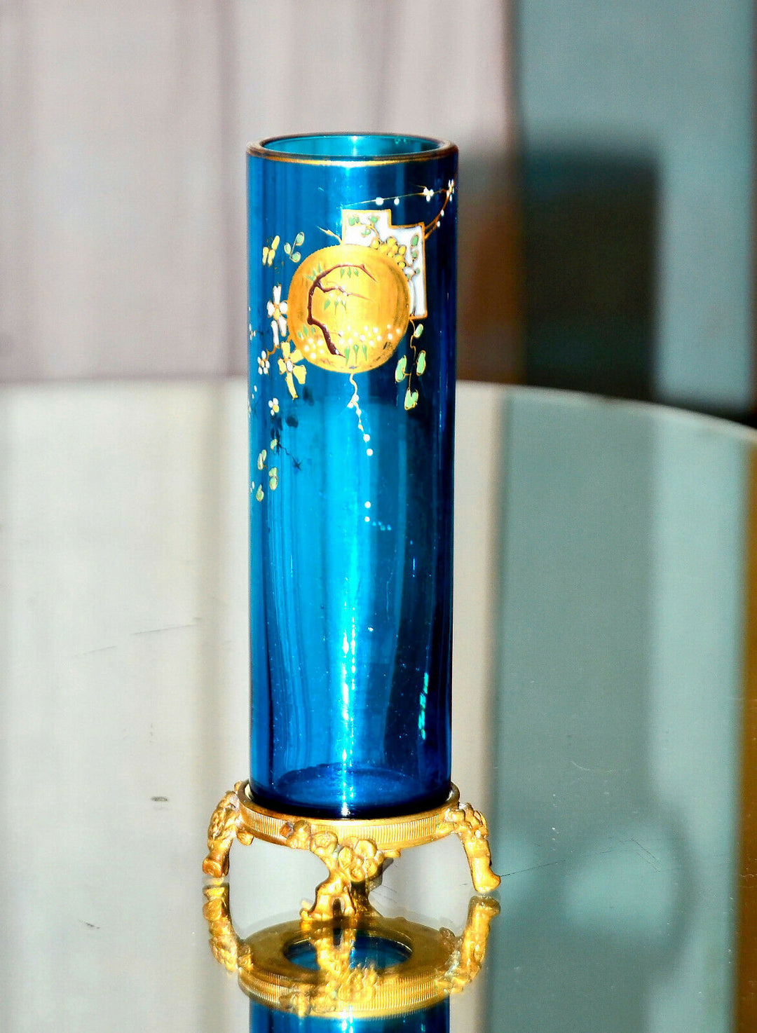 Eugène Rousseau, & BACCARAT. Vase rouleau en cristal bleu émaillé, monté bronze.