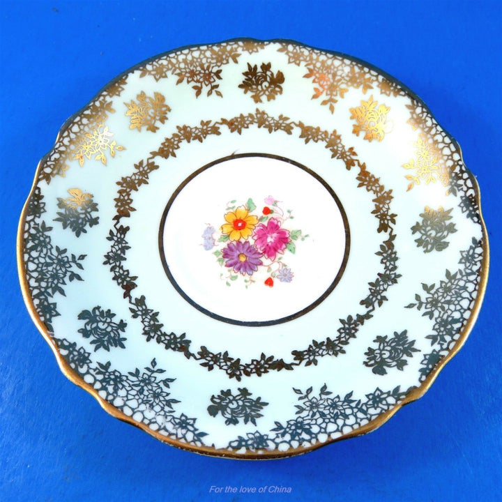 パラゴン　淡いグリーンに可愛いゴールドの模様とお花のカップ&ソーサー