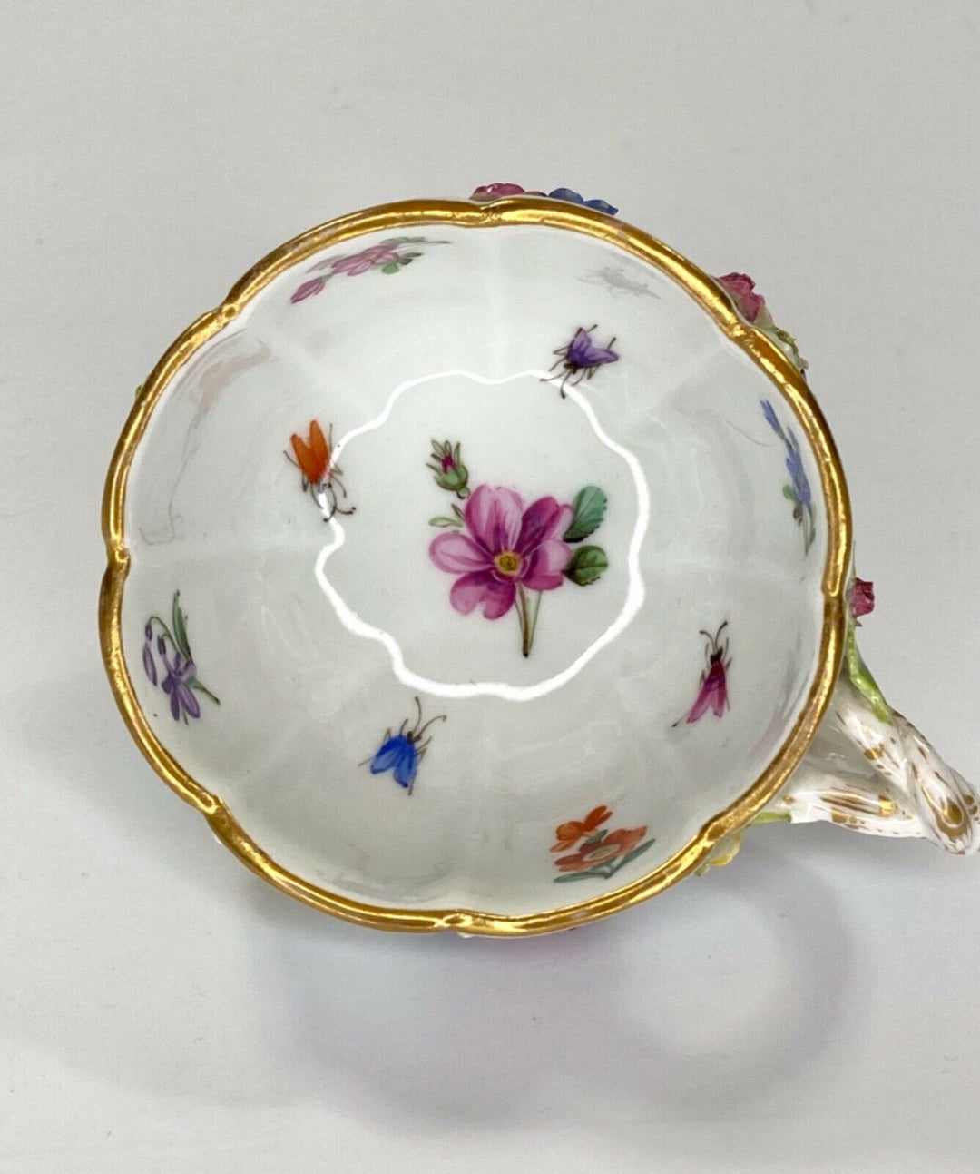 Meissen porcelain cup & saucer. Flower & Fruit encrusted, c. 1870.