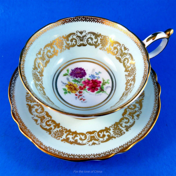 パラゴン　ブルー地にゴールドガーランド＆カラフルな花模様のカップ&ソーサー