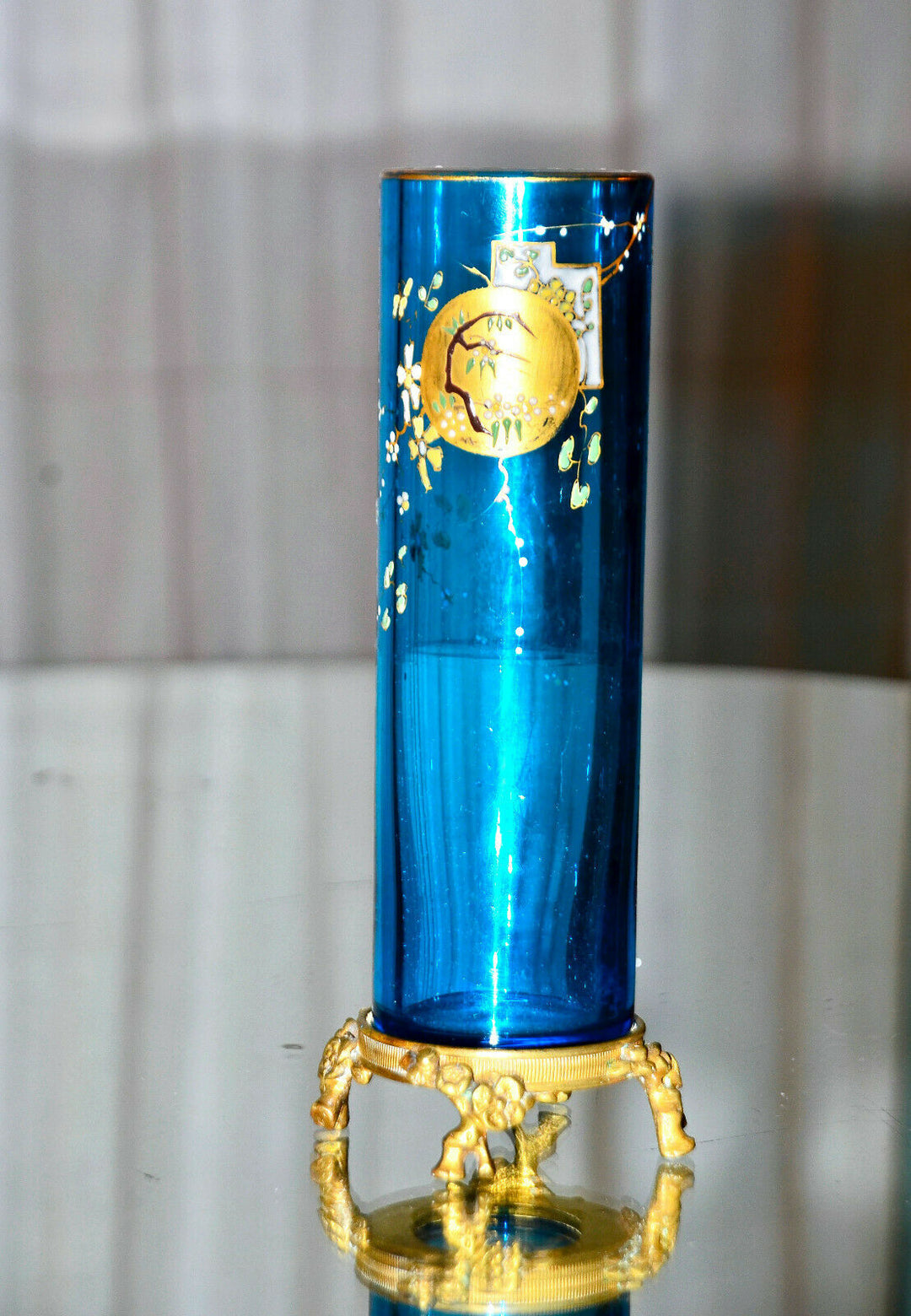 Eugène Rousseau, & BACCARAT. Vase rouleau en cristal bleu émaillé, monté bronze.