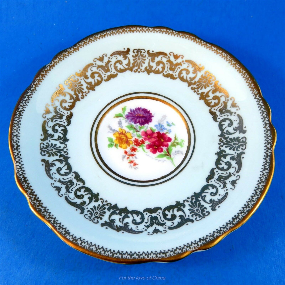 パラゴン　ブルー地にゴールドガーランド＆カラフルな花模様のカップ&ソーサー