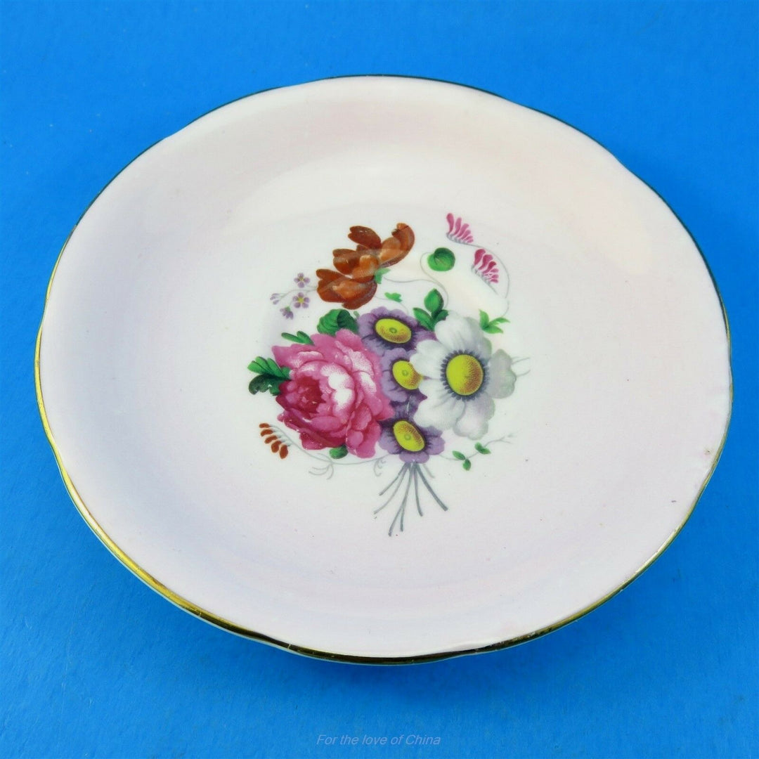 パラゴン　ライトピンク地に煌めくフローラルブーケ　カップ&ソーサー