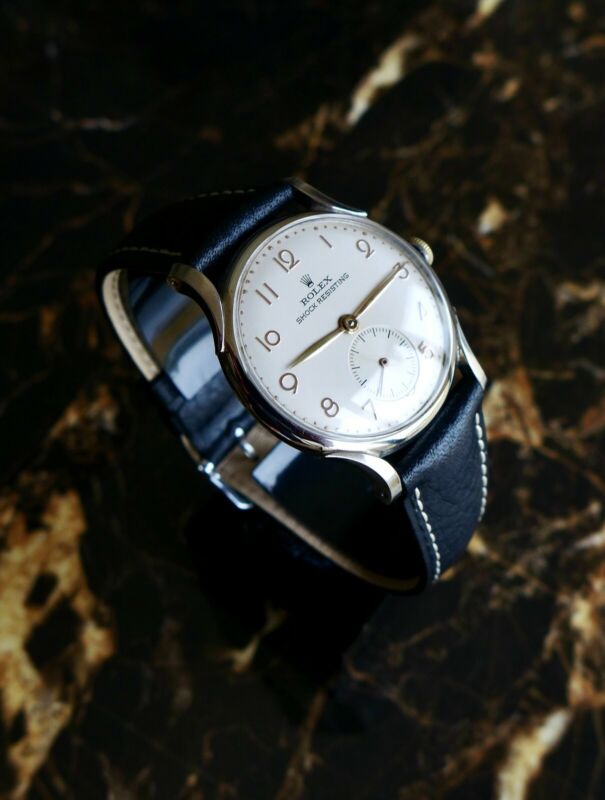 A BEAUTIFUL VINTAGE 1946 MID-SIZE ROLEX PRECISION WATCH WITH FANCY LUGS IN STEEL