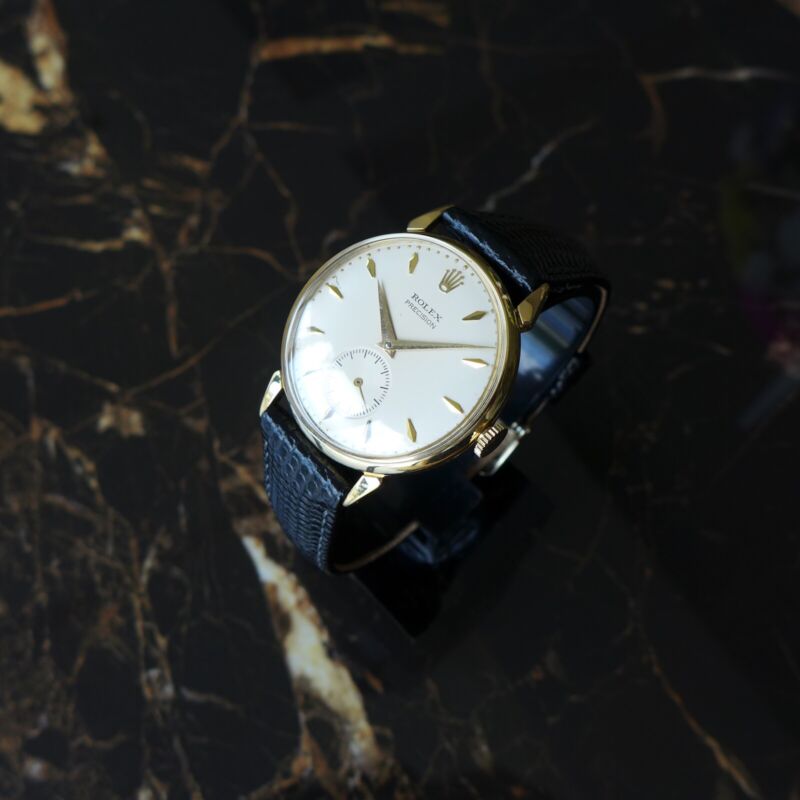 A BEAUTIFUL VINTAGE 1950s GENTS ROLEX PRECISION WITH FANCY LUGS IN 18K GOLD