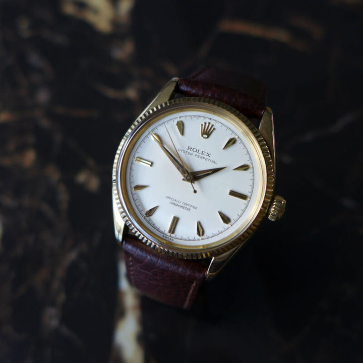 A STUNNING GENTS VINTAGE 1955 ROLEX OYSTER PERPETUAL WATCH IN 18K GOLD REF 6567