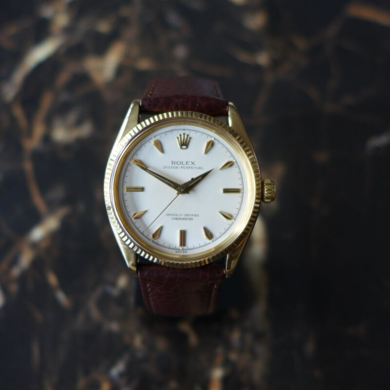 A STUNNING GENTS VINTAGE 1955 ROLEX OYSTER PERPETUAL WATCH IN 18K GOLD REF 6567