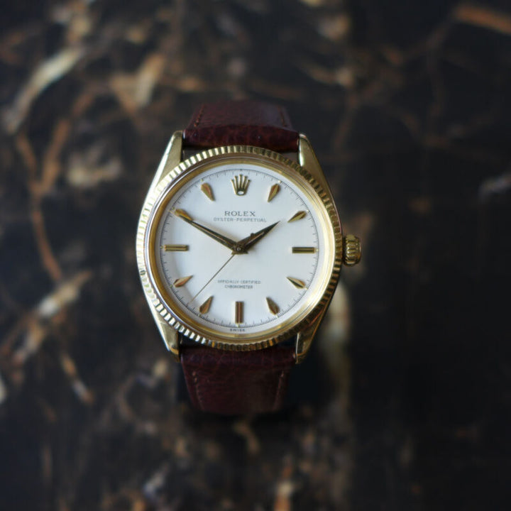 A STUNNING GENTS VINTAGE 1955 ROLEX OYSTER PERPETUAL WATCH IN 18K GOLD REF 6567