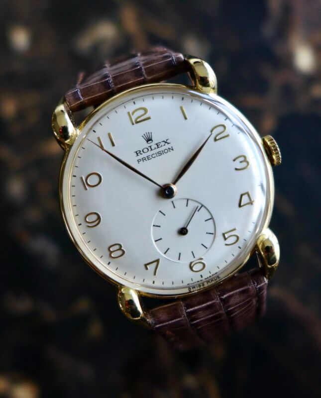 A BEAUTIFUL VINTAGE 1947 GENTS ROLEX PRECISION WITH LARGE HORN LUGS IN 18K GOLD