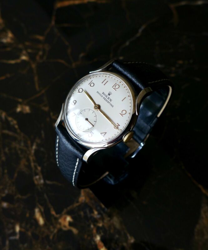 A BEAUTIFUL VINTAGE 1946 MID-SIZE ROLEX PRECISION WATCH WITH FANCY LUGS IN STEEL