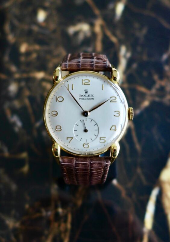 A BEAUTIFUL VINTAGE 1947 GENTS ROLEX PRECISION WITH LARGE HORN LUGS IN 18K GOLD