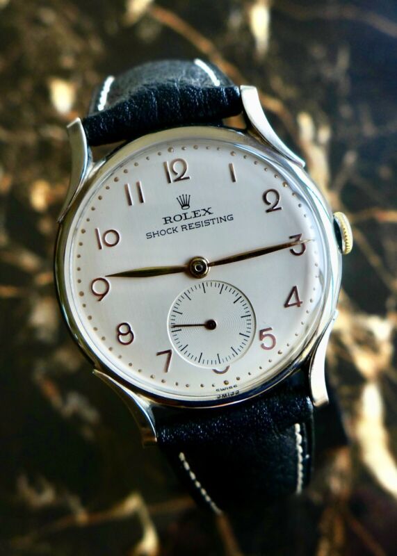 A BEAUTIFUL VINTAGE 1946 MID-SIZE ROLEX PRECISION WATCH WITH FANCY LUGS IN STEEL