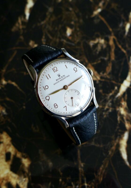 A BEAUTIFUL VINTAGE 1946 MID-SIZE ROLEX PRECISION WATCH WITH FANCY LUGS IN STEEL