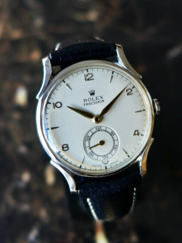 A BEAUTIFUL VINTAGE 1946 MID-SIZE ROLEX PRECISION WATCH WITH FANCY LUGS IN STEEL