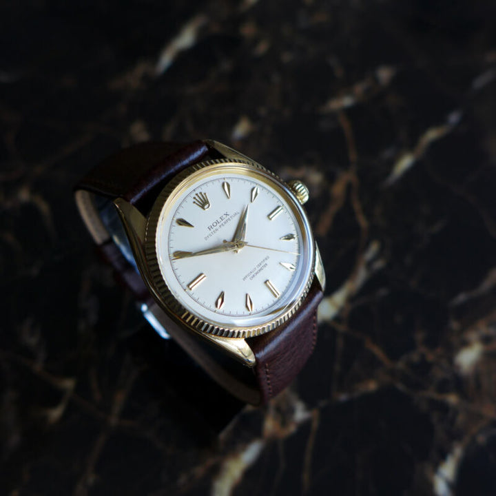 A STUNNING GENTS VINTAGE 1955 ROLEX OYSTER PERPETUAL WATCH IN 18K GOLD REF 6567