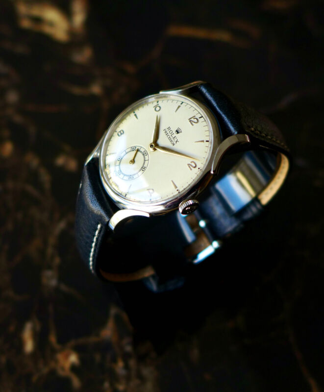A BEAUTIFUL VINTAGE 1946 MID-SIZE ROLEX PRECISION WATCH WITH FANCY LUGS IN STEEL