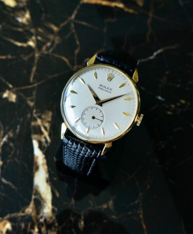 A BEAUTIFUL VINTAGE 1950s GENTS ROLEX PRECISION WITH FANCY LUGS IN 18K GOLD