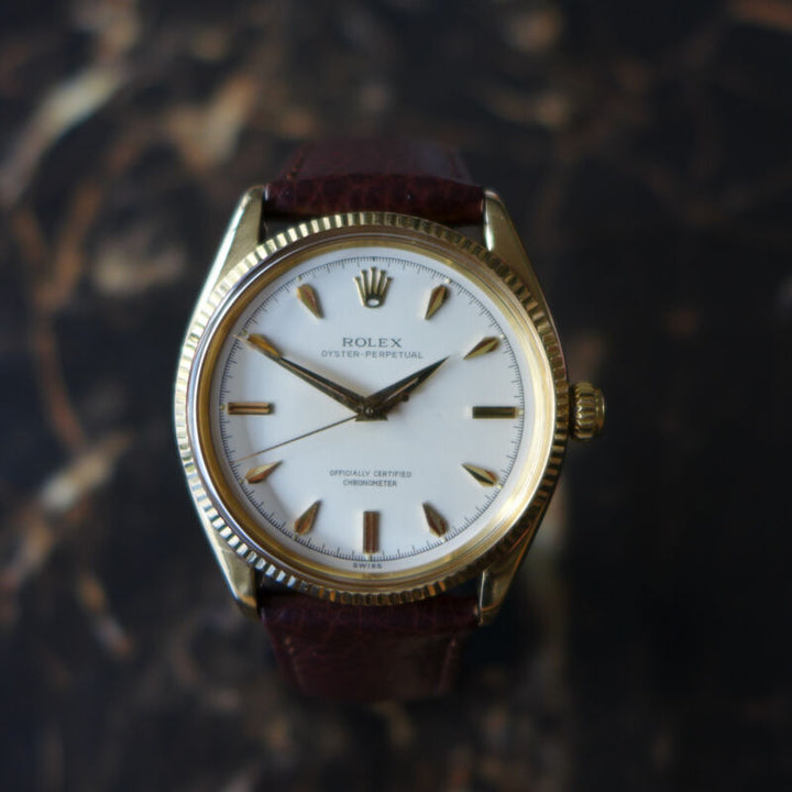 A STUNNING GENTS VINTAGE 1955 ROLEX OYSTER PERPETUAL WATCH IN 18K GOLD REF 6567