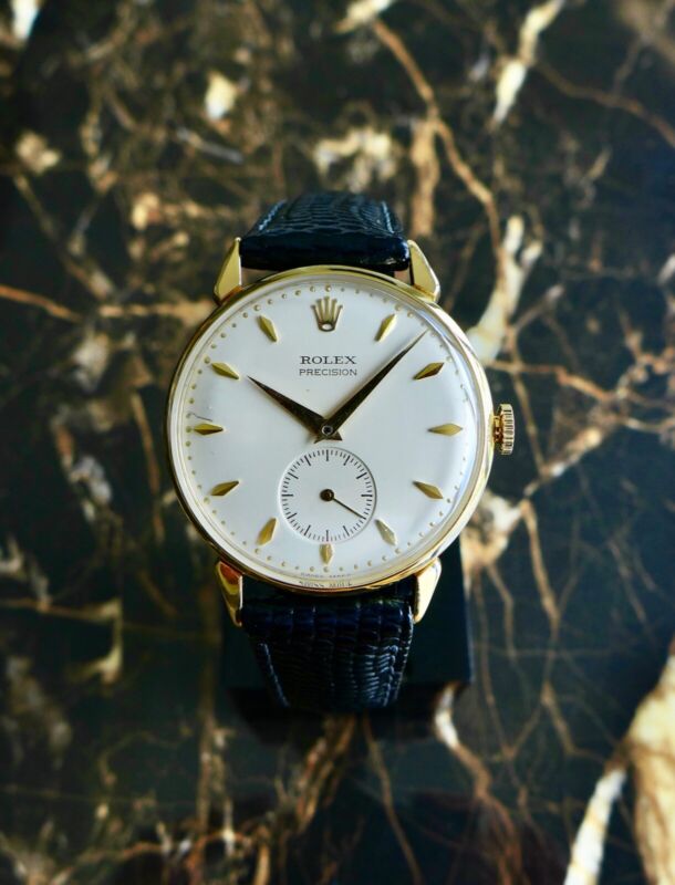 A BEAUTIFUL VINTAGE 1950s GENTS ROLEX PRECISION WITH FANCY LUGS IN 18K GOLD