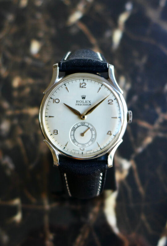 A BEAUTIFUL VINTAGE 1946 MID-SIZE ROLEX PRECISION WATCH WITH FANCY LUGS IN STEEL